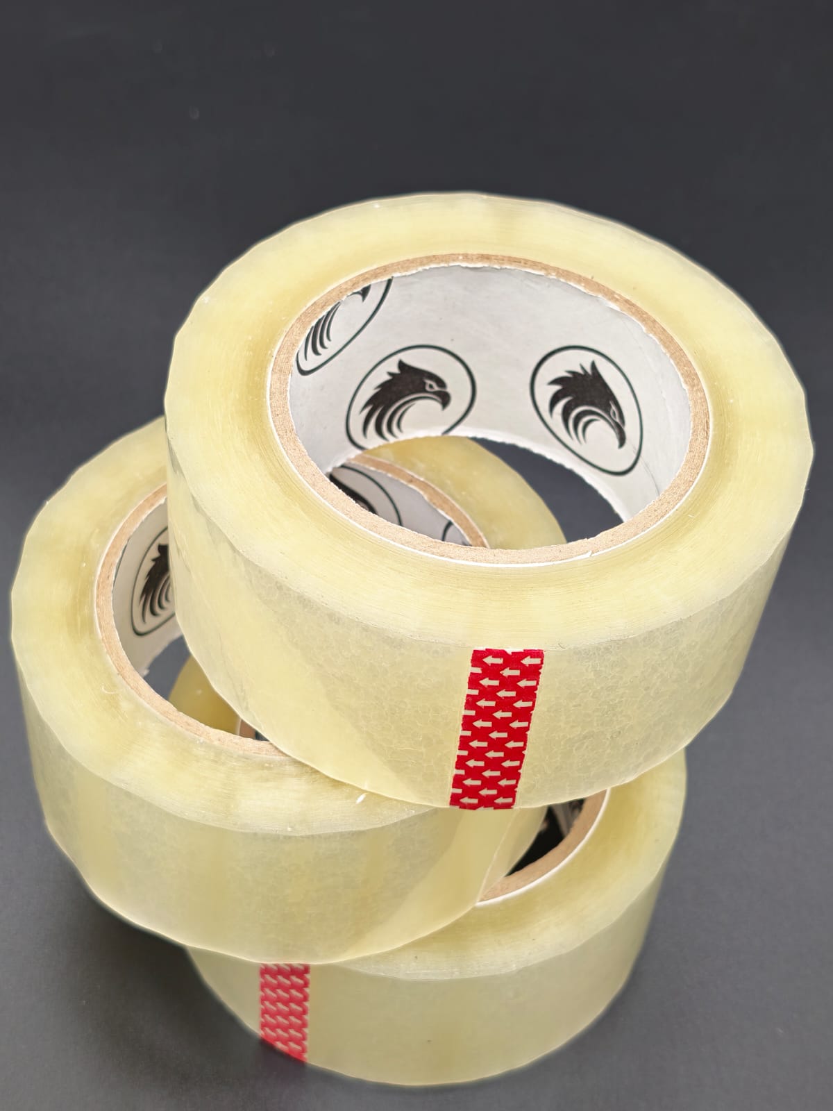 Phoenix Global 2 inch by 110 yard BOPP packing tape, clear, 2 mil thickness, single roll on dark studio backdrop